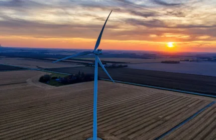 Wind turbines on the horizon, symbolizing IT and engineering systems for clean energy.