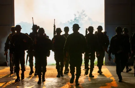 Military personnel standing together representing defense operations.